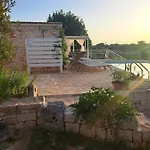 Апартаменты Trulli Harmonia Con Piscina -